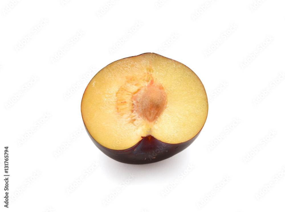 half of plum isolated on white background