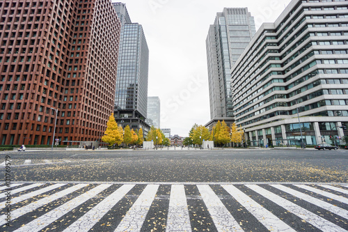 close up crosswalk surrounded by commercial buildings in Tokyo station taken in Japan on 4 December 2016