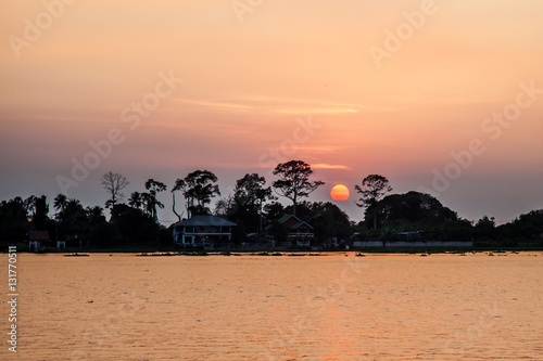 Sunset landscapes with orange sky and lake. Outdoor photograph