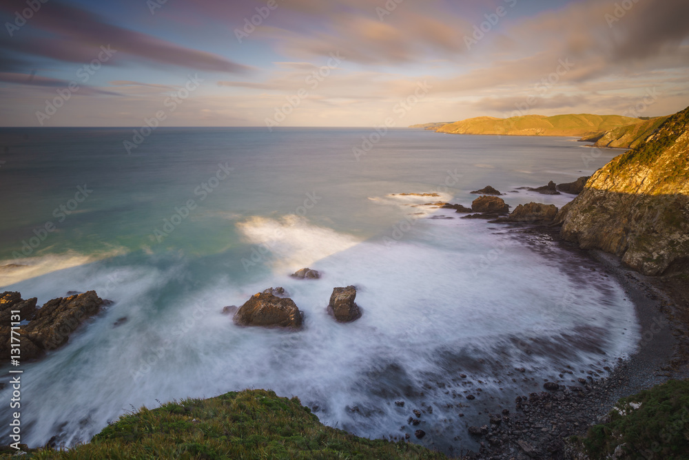 Fototapeta premium Sunrise From Lookout Point at Nugget Point Lighthouse, Caitlins,