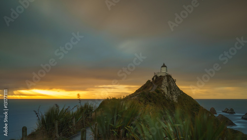 Beautiful And Dramatic Long Exposure Shot Of Sunrise At Nugget P photo