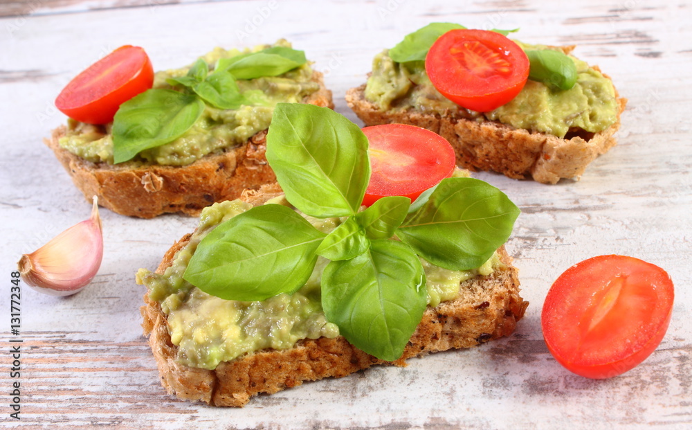 Freshly sandwiches with paste of avocado and ingredients, healthy food and nutrition Freshly sandwiches with paste of avocado and ingredients, healthy food and nutrition