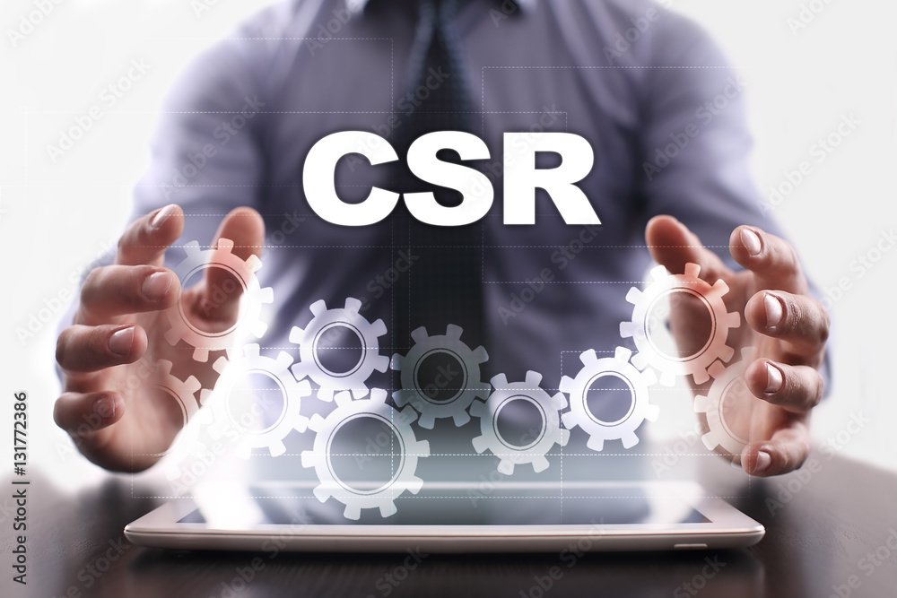 Naklejka premium Businessman is using tablet pc and selecting csr.