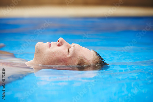 Floating in swimming pool