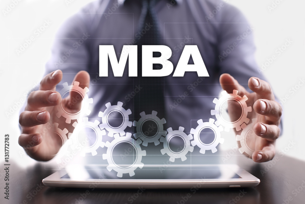 Naklejka premium Businessman is using tablet pc and selecting mba.