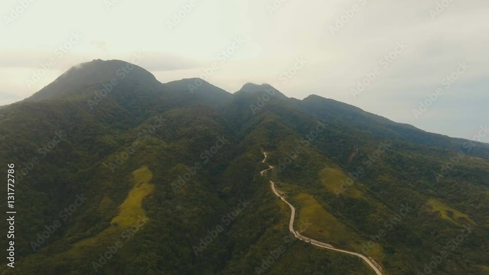 Aerial view trees and palms.Road in the jungle mountains. Aerial footage.Aerial video from flying drone of amazingly beautiful landscape of nature with hills, rain forest. Philippines, Camiguin. 4K Aerial view trees and palms.Road in the jungle mountains. Aerial footage.Aerial video from flying drone of amazingly beautiful landscape of nature with hills, rain forest. Philippines, Camiguin. 4K