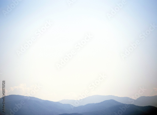 Blue mountain with blue sky and clouds background with  vignette effect