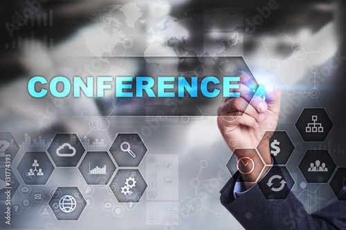Businessman is drawing on virtual screen. conference concept.