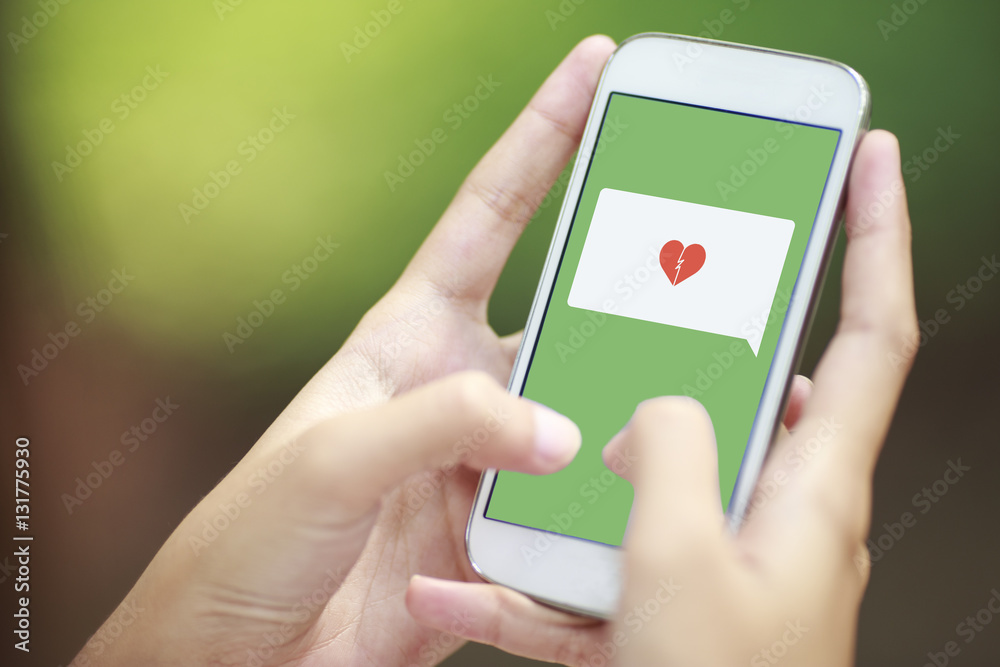 smartphone with speech bubble and broken heart smartphone with speech bubble and broken heart