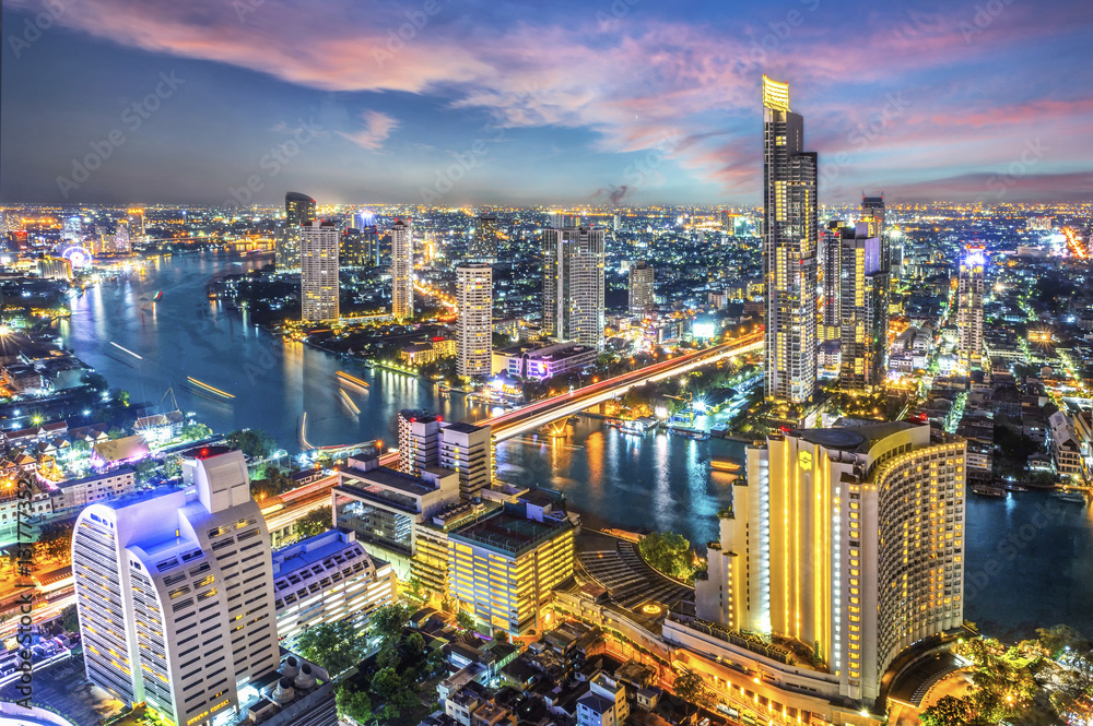Aerial view of Bangkok modern office buildings, condominium, living place in Bangkok city downtown with sunset scenery, Bangkok , Thailand
