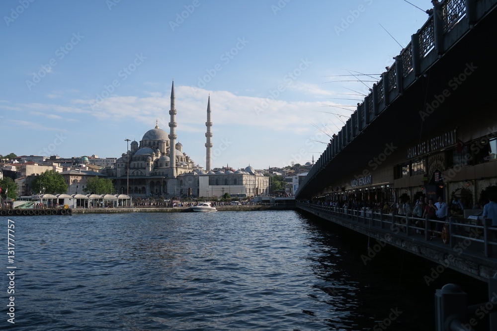 Galata Bridge and Yeni Camii Mosque at the Golden Horn in Istanbul, Turkey Galata Bridge and Yeni Camii Mosque at the Golden Horn in Istanbul, Turkey