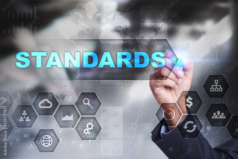 Businessman is drawing on virtual screen. standards concept. Businessman is drawing on virtual screen. standards concept.
