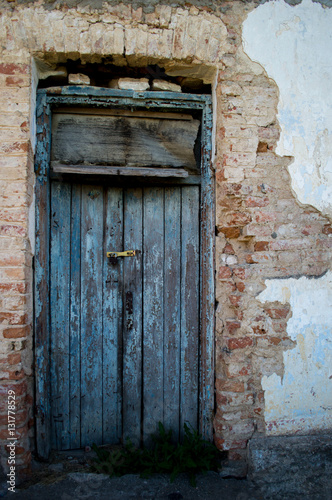Old closed door. © Tatsiana
