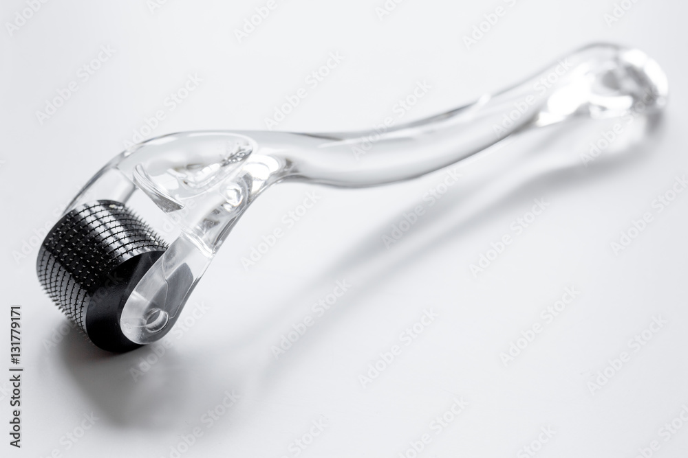 concept beautician desktop with mezoroller - mesotherapy on white background concept beautician desktop with mezoroller - mesotherapy on white background