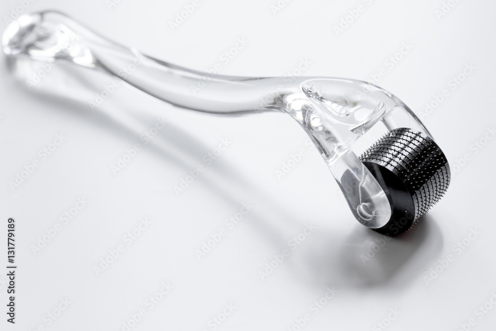 concept beautician desktop with mezoroller - mesotherapy on white background concept beautician desktop with mezoroller - mesotherapy on white background