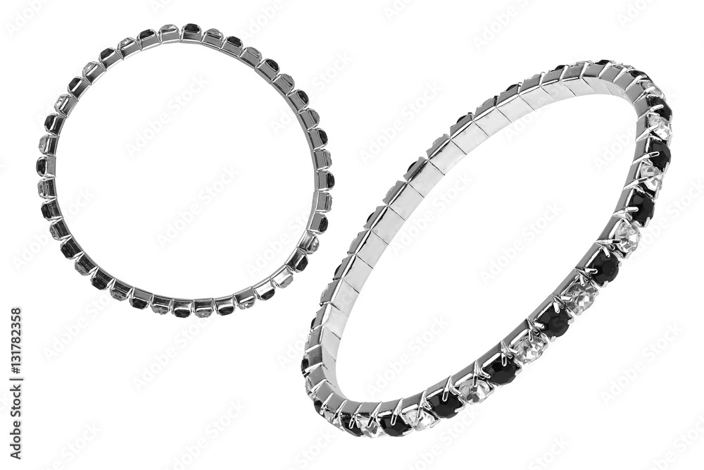 Two instances of an elastic metallic silver bracelet with black and white semiprecious stones, isolated on white background, clipping paths included Two instances of an elastic metallic silver bracelet with black and white semiprecious stones, isolated on white background, clipping paths included