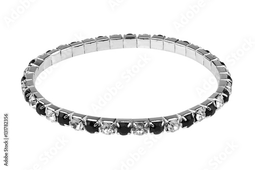 Elastic metallic silver bracelet with black and white semiprecious stones, isolated on white background, clipping path included