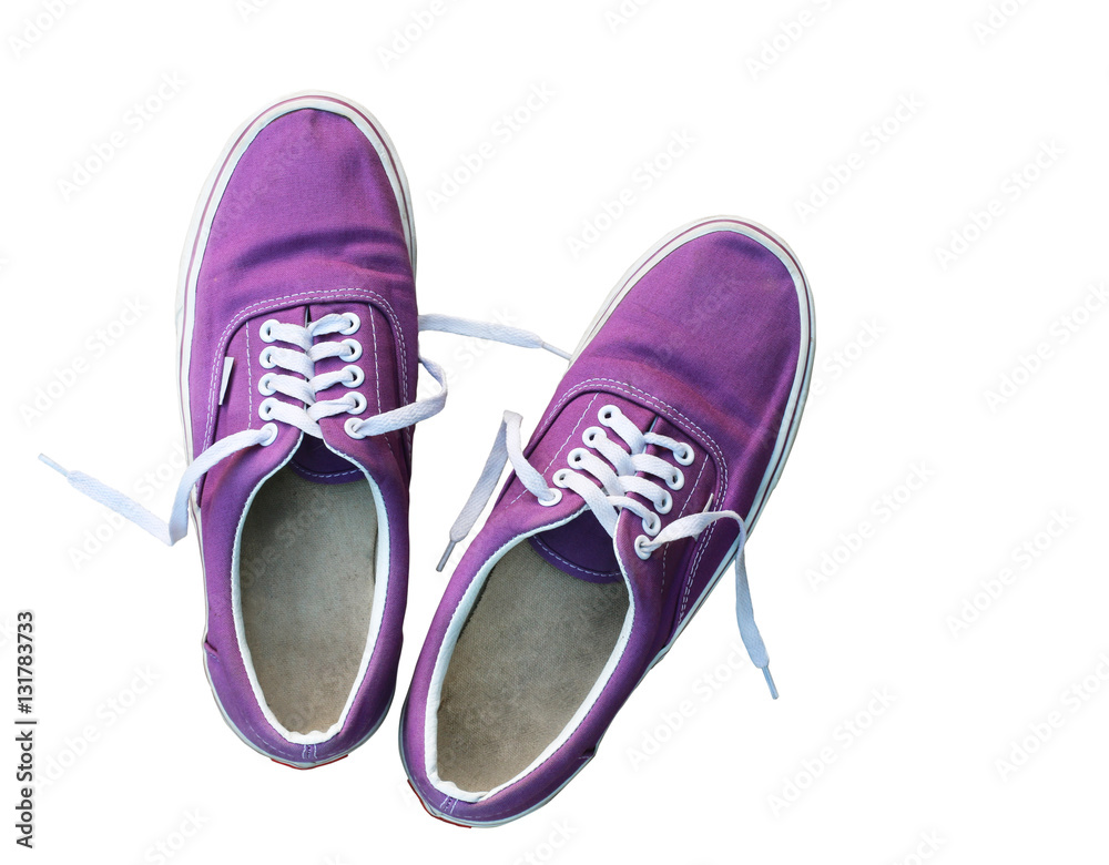 Top view of a pair of purple sneakers shoes isolated on white with clipping path.