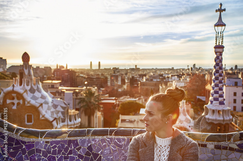 Photography elegant woman at Guell Park in Barcelona, Spain looking aside
