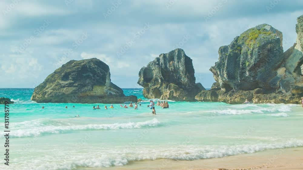 People Swimming at Horseshoe Bay Beach in Bermuda, featuring Turquoise Colored Water on a Sunny Day