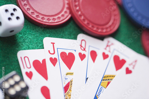 poker playcard dice on green table.Bet photo