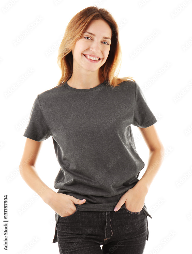 Obraz premium Young woman in blank grey t-shirt on white background