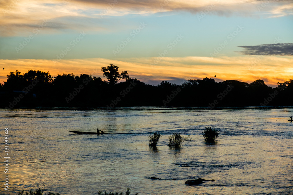 Boat on the Mekong river at sunrise