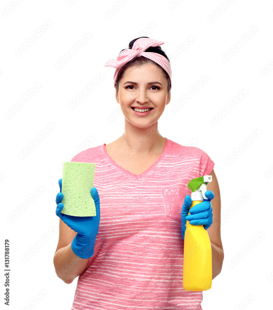 Young cleaner with sponge and spray on white background Young cleaner with sponge and spray on white background