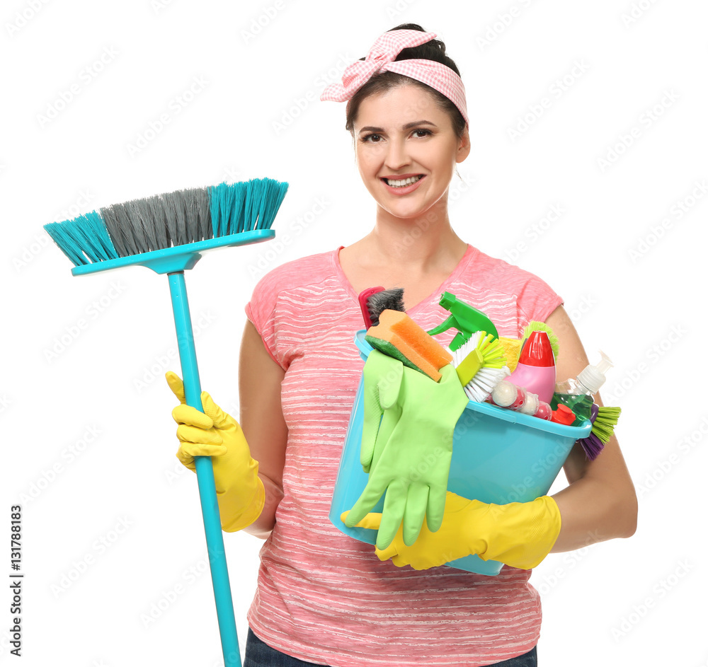 Young cleaner with cleaning tools on white background Young cleaner with cleaning tools on white background