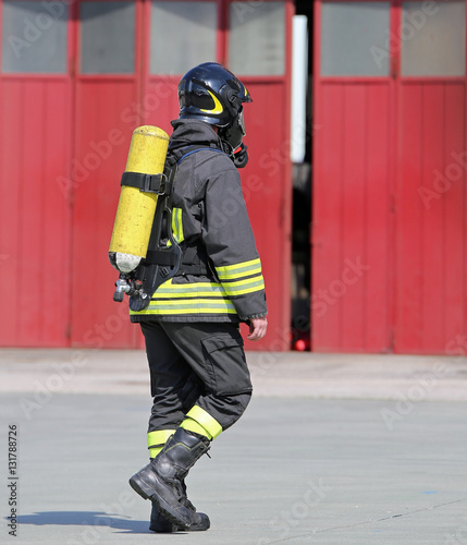 Fireman with oxygen tank to breathe during fire