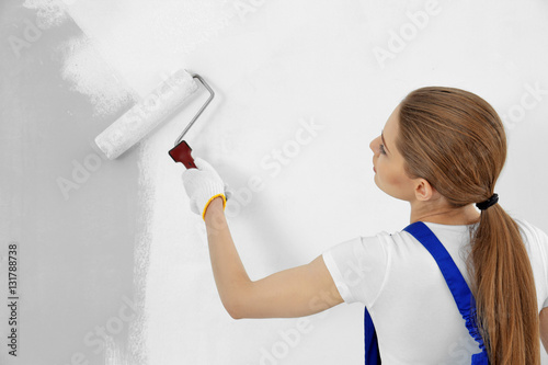 Beautiful young woman paint...