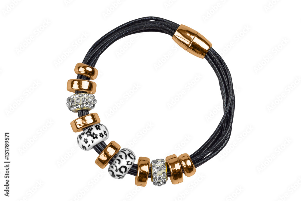 Black textile bracelet with golden rings and silver decorations, isolated on white background, clipping path included Black textile bracelet with golden rings and silver decorations, isolated on white background, clipping path included