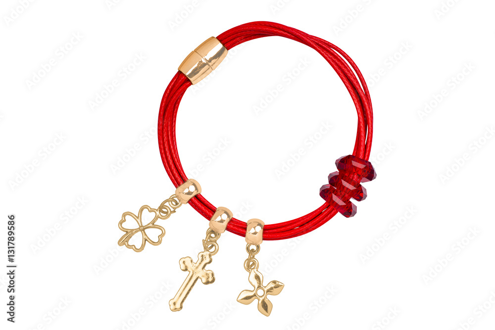 Red textile bracelet with golden ring and gold charms decorations, isolated on white background, clipping path included Red textile bracelet with golden ring and gold charms decorations, isolated on white background, clipping path included