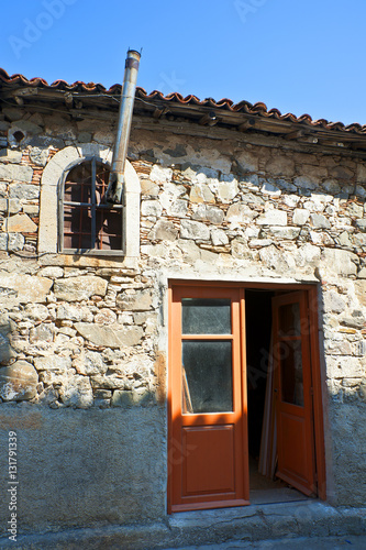 Myrna Limnos Greece Open door old stone house. photo