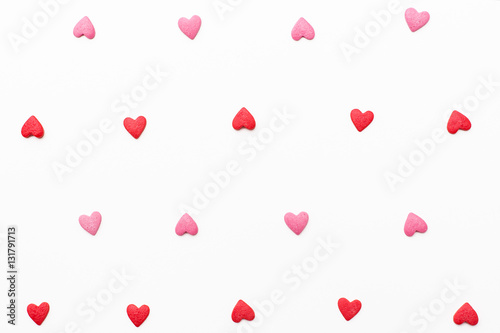 background of small red and pink hearts. Festive background for Valentine's day, birthday, wedding, holiday, postcard, party
