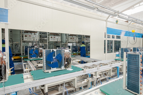 factory floor for production and assembly of household air conditioners on the conveyor belt