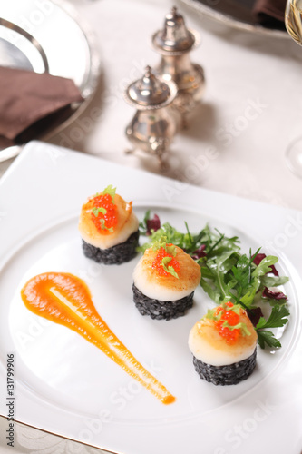 Fine dining - scallops on black rice