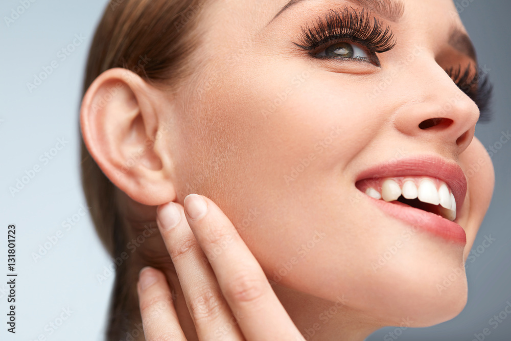 Long Black Eyelashes. Woman Face With Soft Skin, Beauty Makeup Long Black Eyelashes. Woman Face With Soft Skin, Beauty Makeup