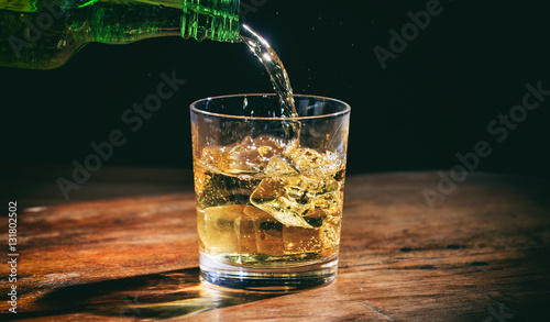 Pouring whiskey in a glass
