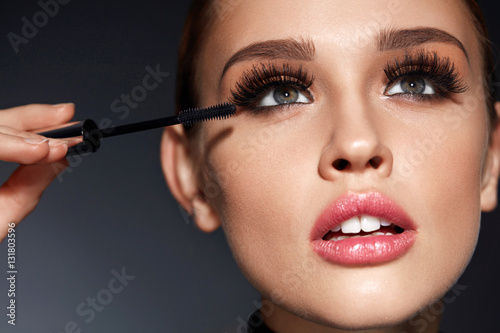 Woman With Beauty Makeup, Long Black Eyelashes Applying Mascara