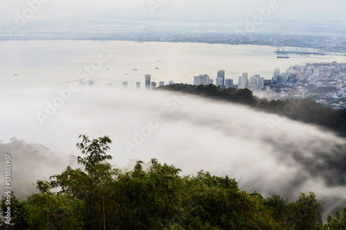 Cityscape, mountain and fog sea view for background