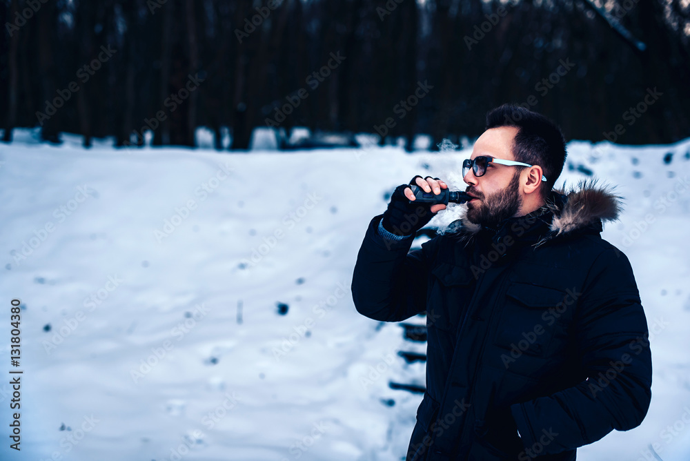 Man with beard vape electronic cigarette outdoor Man with beard vape electronic cigarette outdoor