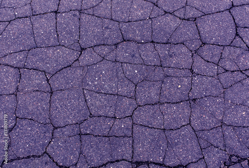 Blue toned damaged asphalt texture. photo