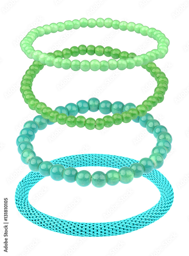 Set of three green elastic bracelets made of pearl-like beads, isolated on white background, clipping path included Set of three green elastic bracelets made of pearl-like beads, isolated on white background, clipping path included