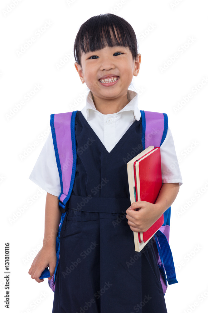 Φωτογραφία Asian Chinese little primary school girl holding books with bag