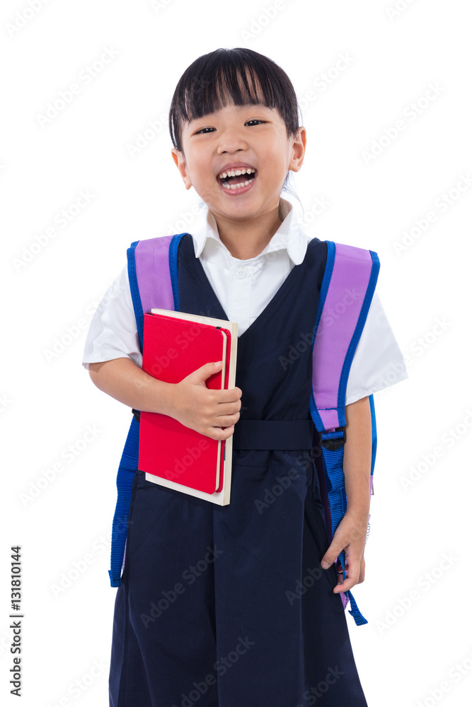 Φωτογραφία Asian Chinese little primary school girl holding books with bag