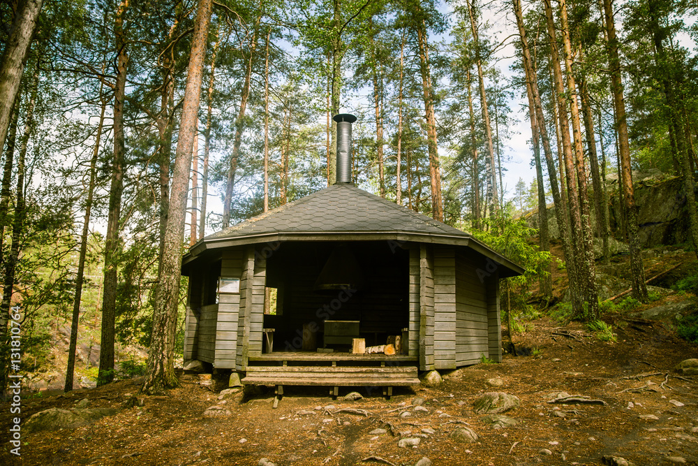 A beautiful small wooden building in the middle of Finnish forest