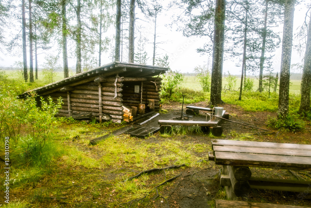 A beautiful small wooden building in the middle of Finnish forest