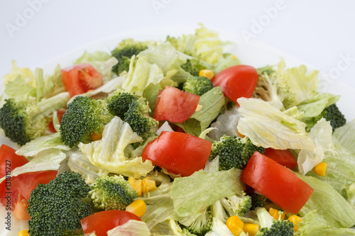 Fresh vegetable on a white plate. Healthy vegetarian food
