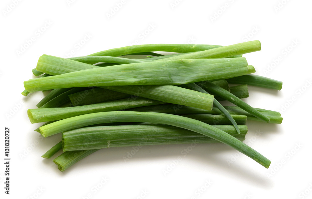 Sliced, chopped spring onions, salad onions, green onions or scallions on the white background Sliced, chopped spring onions, salad onions, green onions or scallions on the white background